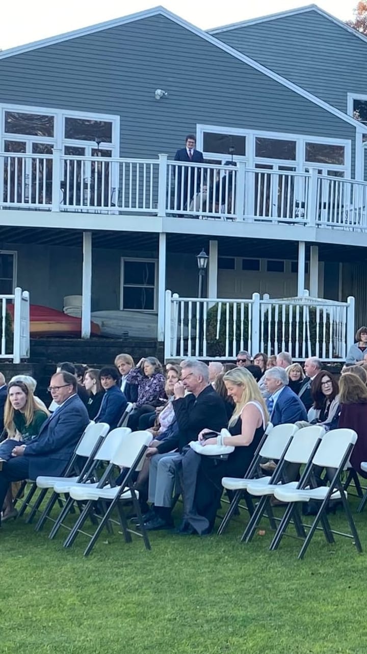 Guests seated on the lawn, the ceremony about to start